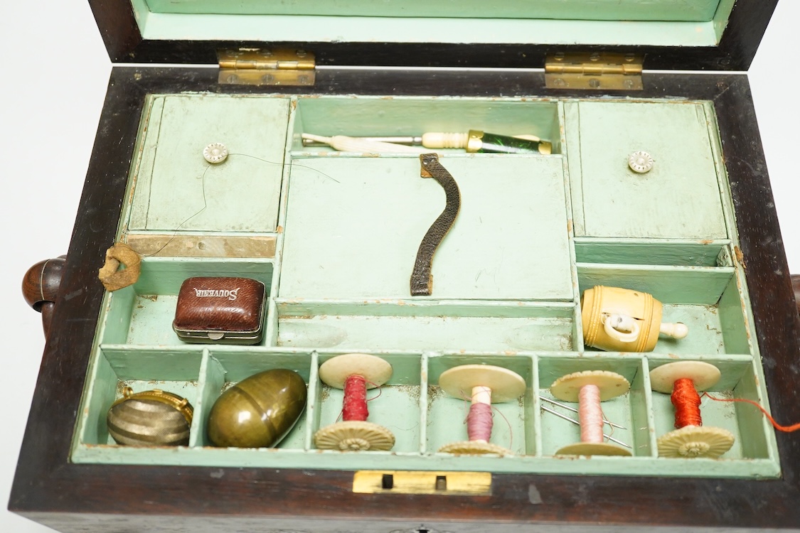 A Victorian mother of pearl inlaid rosewood sewing box and contents including a silver thimble and carved bone thread reels, 33cm wide